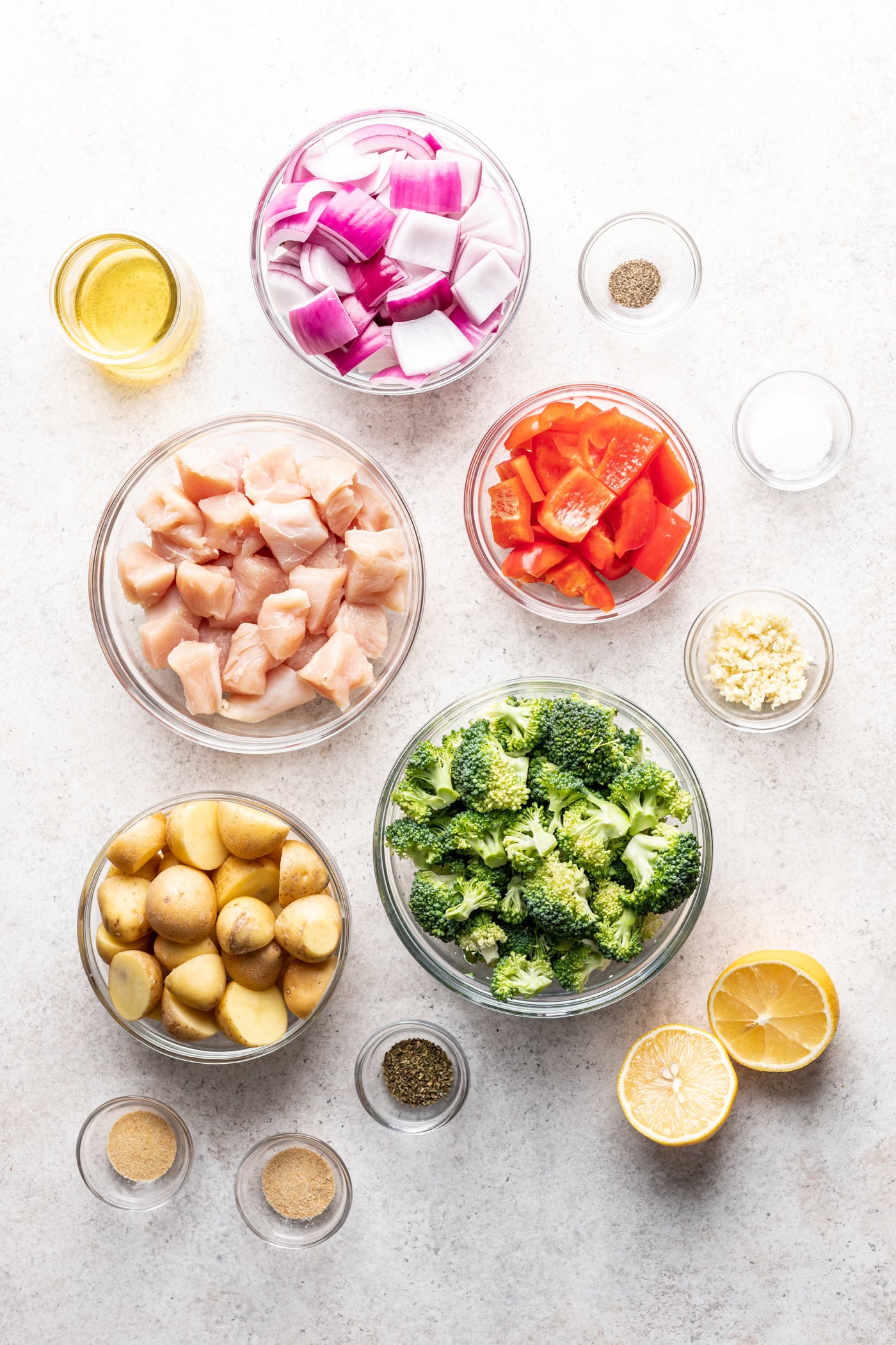 bowls of chopped ingredients on a grey background