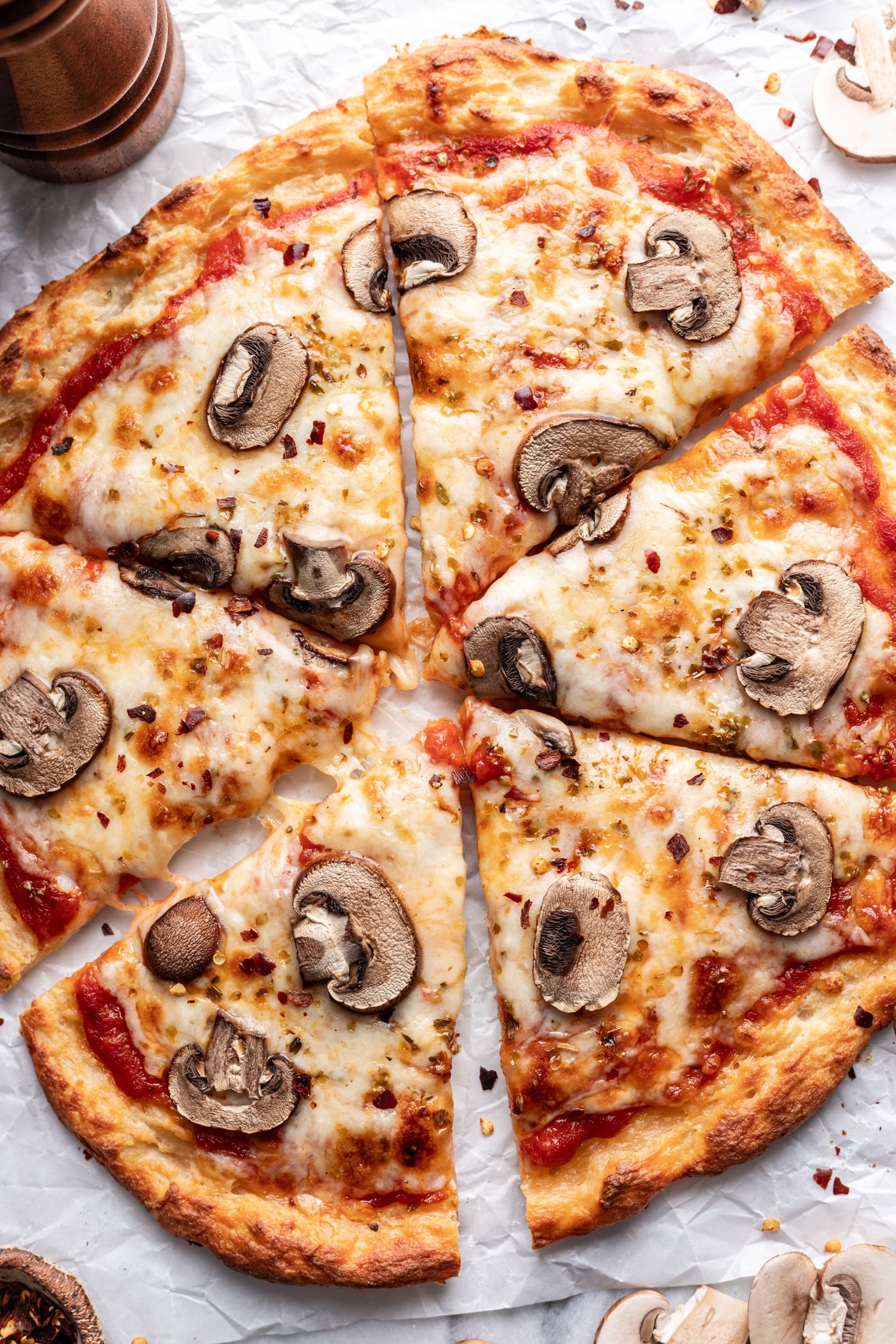 mushroom pizza over head shot cut into 6 slices