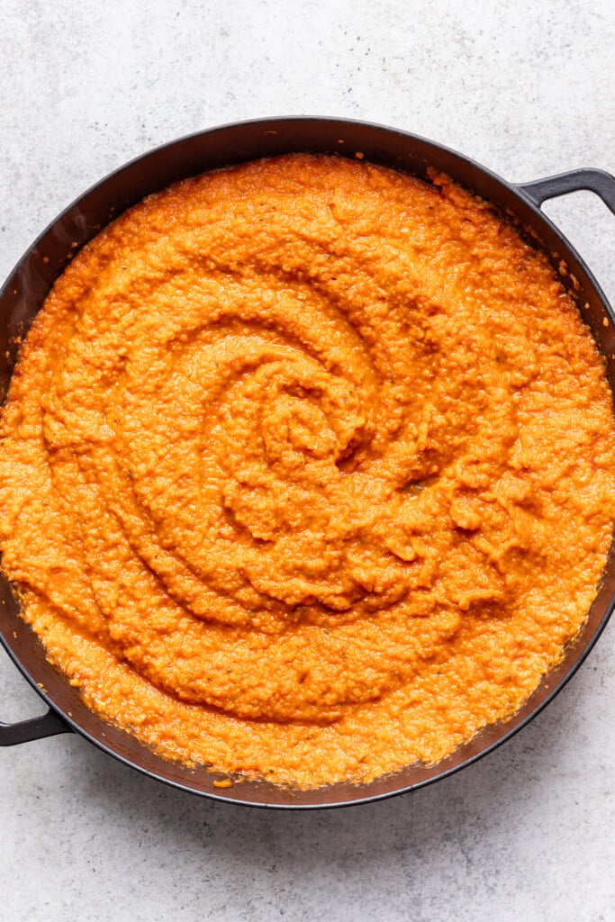 A pan filled with a thick sauce
