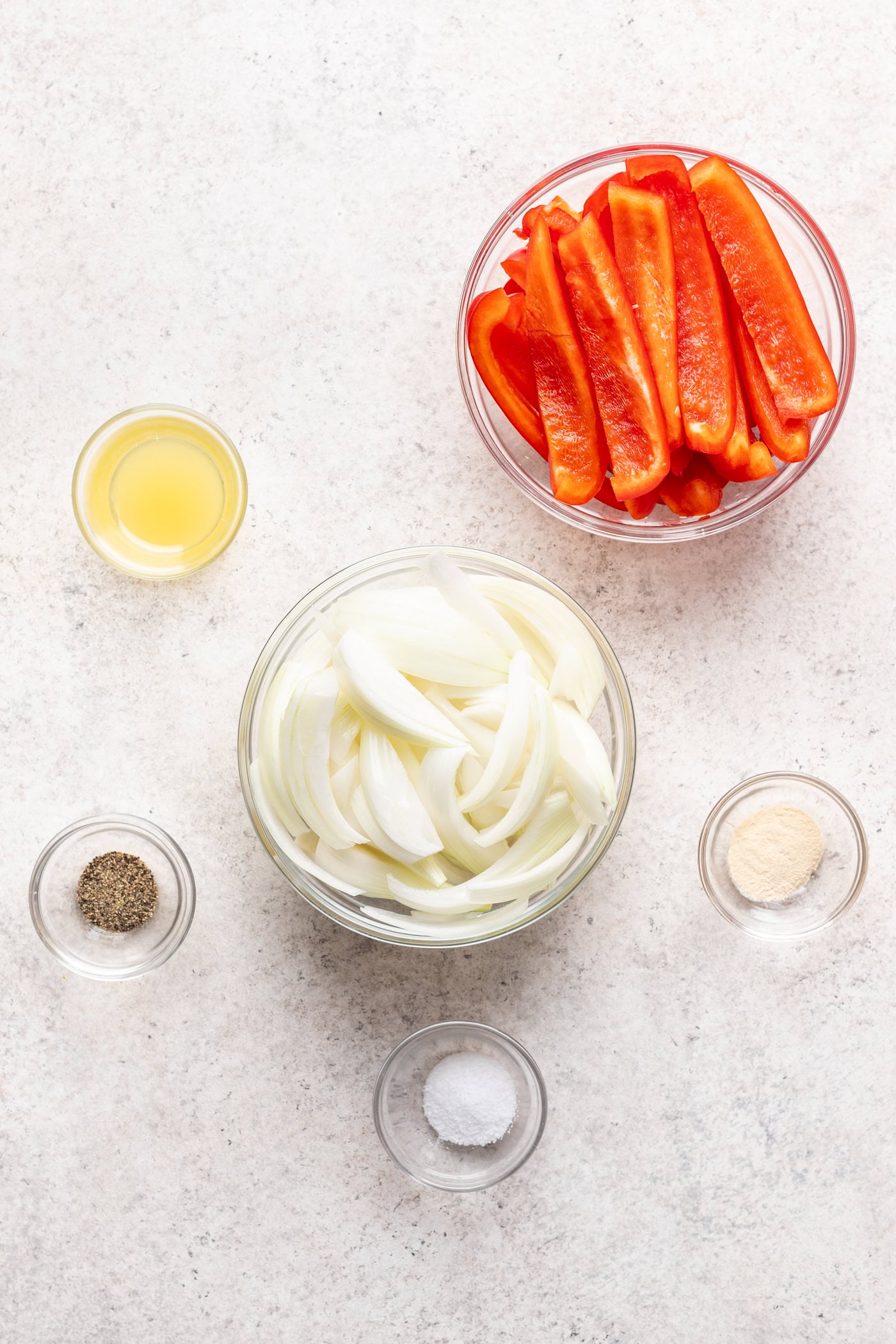 bowls of ingredients on a grey background