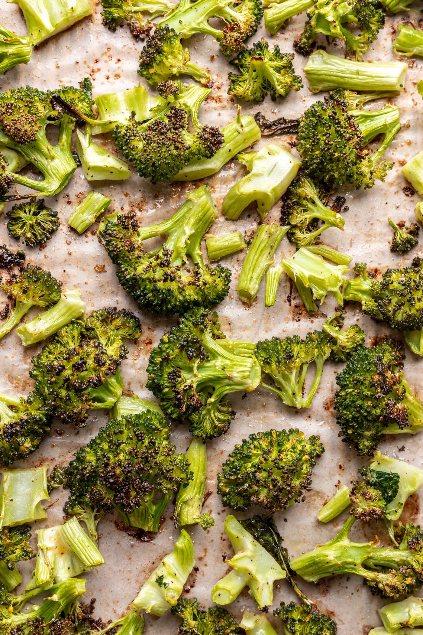 crispy broccoli florets on a sheet pan