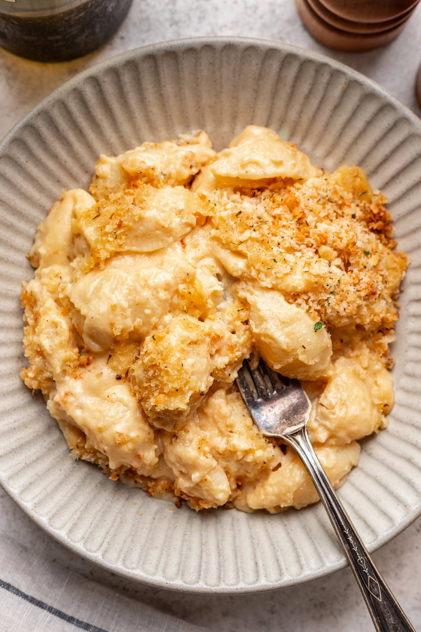 bowl of mac n cheese with panko topping