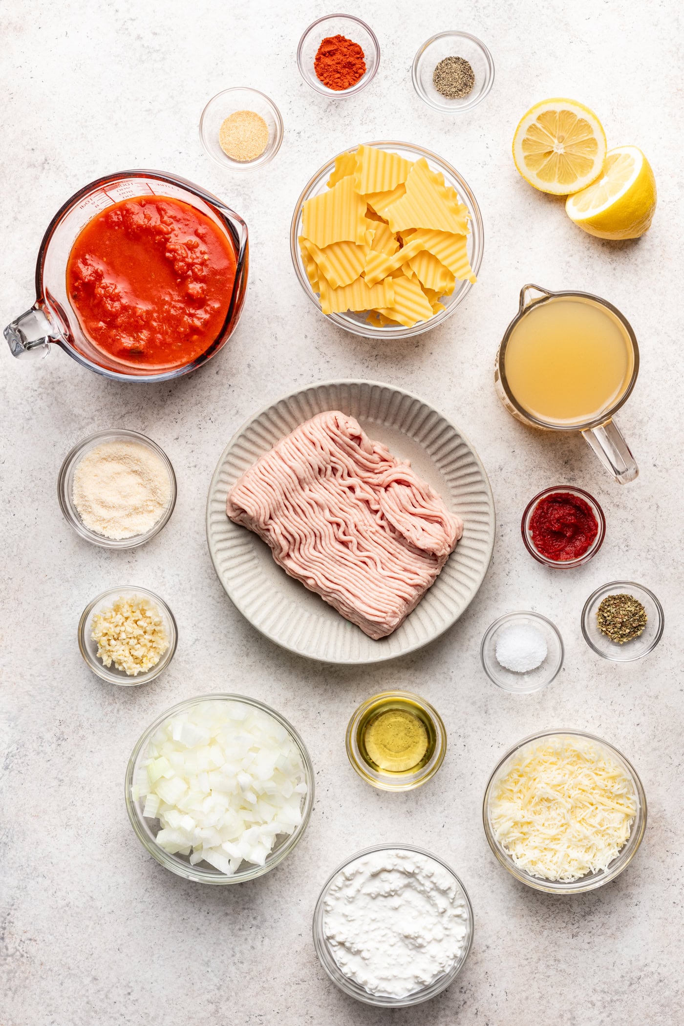 bowls of ingredients on a grey background