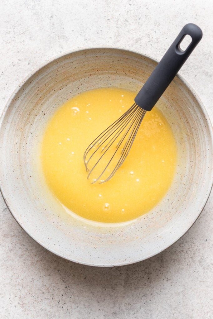 eggs and oil whisked in a bowl