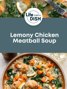 Overhead view of a bowl of lemony chicken meatball soup with spinach, carrots, rice, and lemon slices, garnished with herbs. Text reads “Lemony Chicken Meatball Soup—Cupcakes And Coffee Breaks.”.