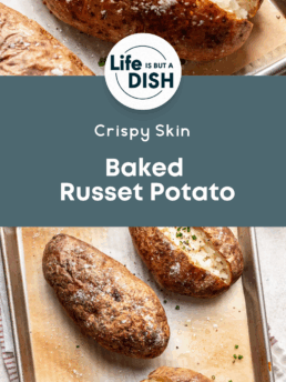 A tray of crispy, baked russet potatoes topped with chopped chives, some split open to show fluffy insides. The text reads: Cupcakes And Coffee Breaks. Crispy Skin Baked Russet Potato.