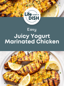 Grilled chicken breasts with visible grill marks, garnished with lemon wedges and herbs, served on white plates. Text overlay says “Easy Juicy Yogurt Marinated Chicken” by Cupcakes And Coffee Breaks.